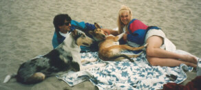 Kallie and her foster parents on the beach
